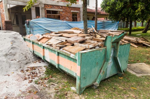 Waste clearance process being carried out at a Wallington construction site